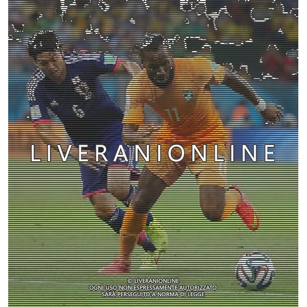 (140614) -- RECIFE, June 14, 2014 () -- Cote d\'Ivoire\'s Didier Drogba vies with Japan\'s Masato Morishige during a Group C match between Cote d\'Ivoire and Japan of 2014 FIFA World Cup in the Aren Pernambuco Stadium in Recife, Brazil, June 14, 2014. (/Cao Can)(rh) ©PHOTOSHOT/Agenzia Aldo Liverani sas - ITALY ONLY - EDITORIAL USE ONLY - Costa d\'Avorio Vs Giappone partita del Gruppo C della coppa del mondo 2014 FIFA World Cup Stadium Arena Pernambuco a Recife, in Brasile, 14 giugno 2014