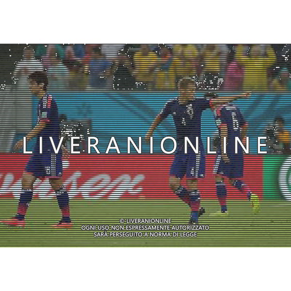 (140614) -- RECIFE, June 14, 2014 () -- Japan\'s Keisuke Honda (C) reacts during a Group C match between Cote d\'Ivoire and Japan of 2014 FIFA World Cup in the Aren Pernambuco Stadium in Recife, Brazil, June 14, 2014. (/Cao Can)(rh) ©PHOTOSHOT/Agenzia Aldo Liverani sas - ITALY ONLY - EDITORIAL USE ONLY - Costa d\'Avorio Vs Giappone partita del Gruppo C della coppa del mondo 2014 FIFA World Cup Stadium Arena Pernambuco a Recife, in Brasile, 14 giugno 2014