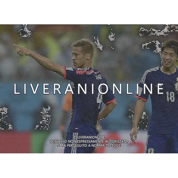 (140614) -- RECIFE, June 14, 2014 () -- Japan\'s Keisuke Honda (L) celebrates for his goal during a Group C match between Cote d\'Ivoire and Japan of 2014 FIFA World Cup at the Arena Pernambuco Stadium in Recife, Brazil, June 14, 2014. (/Yang Lei)(pcy) ©PHOTOSHOT/Agenzia Aldo Liverani sas - ITALY ONLY - EDITORIAL USE ONLY - Costa d\'Avorio Vs Giappone partita del Gruppo C della coppa del mondo 2014 FIFA World Cup Stadium Arena Pernambuco a Recife, in Brasile, 14 giugno 2014