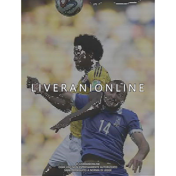 (140614) -- BELO HORIZONTE, June 14, 2014 () -- Greece\'s Dimitris Salpingidis (R) competes with Colombia\'s Carlos Sanchez for a headball during a Group C match between Colombia and Greece of 2014 FIFA World Cup at the Estadio Mineirao Stadium in Belo Horizonte, Brazil, June 14, 2014. Colombia won 3-0 over Greece on Saturday. (/Qi Heng)(pcy) ©PHOTOSHOT/Agenzia Aldo Liverani sas - ITALY ONLY - EDITORIAL USE ONLY - Colombia Vs Grecia partita del Gruppo C Coppa del Mondo FIFA 2014 Mineirao stadio Estadio a Belo Horizonte, in Brasile 14 Giugno 2014