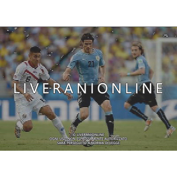 (140614) -- FORTALEZA, June 14, 2014 () -- Uruguay\'s Edinson Cavani vies with Costa Rica\'s Oscar Duarte during a Group D match between Uruguay and Costa Rica of 2014 FIFA World Cup in the Estadio Castelao Stadium in Fortaleza, Brazil, June 14, 2014. (/Guo Yong)(rh) ©PHOTOSHOT/Agenzia Aldo Liverani sas - ITALY ONLY - EDITORIAL USE ONLY - Uruguay vs Costa Rica partita del Gruppo D della Coppa del mondo FIFA 2014 Castelao stadio Estadio a Fortaleza, in Brasile, 14 Giugno 2014