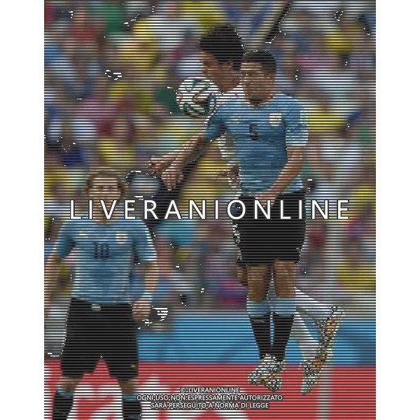(140614) -- FORTALEZA, June 14, 2014 () -- Uruguay\'s Walter Gargano competes a headball during a Group D match between Uruguay and Costa Rica of 2014 FIFA World Cup in the Estadio Castelao Stadium in Fortaleza, Brazil, June 14, 2014. (/Guo Yong)(rh) ©PHOTOSHOT/Agenzia Aldo Liverani sas - ITALY ONLY - EDITORIAL USE ONLY - Uruguay vs Costa Rica partita del Gruppo D della Coppa del mondo FIFA 2014 Castelao stadio Estadio a Fortaleza, in Brasile, 14 Giugno 2014