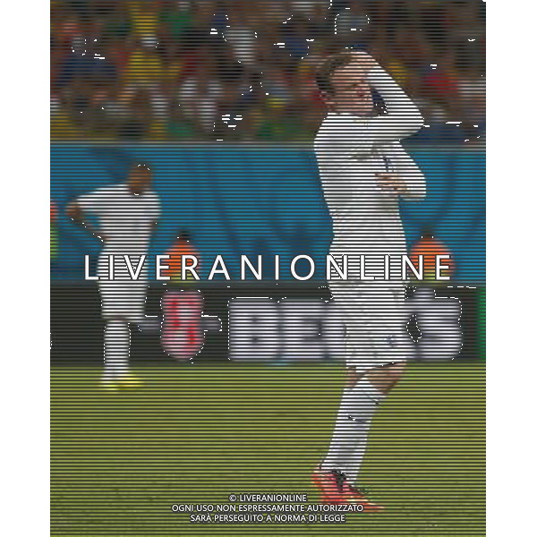 (140614) -- MANAUS, June 14, 2014 () -- England\'s Wayne Rooney reacts during a Group D match between England and Italy of 2014 FIFA World Cup in the Arena Amazonia Stadium in Manaus, Brazil, June 14, 2014. Italy won 2-1 over England on Saturday.(/Wang Lili)(rh) ©PHOTOSHOT/Agenzia Aldo Liverani sas - ITALY ONLY - EDITORIAL USE ONLY - Italia - Inghilterra partita del Gruppo D coppa del mondo 2014 FIFA World Cup Stadio all\'Arena Amazzonia a Manaus, Brasile, 14 giugno 2014