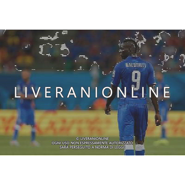 (140614) -- MANAUS, June 14, 2014 () -- Italy\'s Mario Balotelli reacts during a Group D match between England and Italy of 2014 FIFA World Cup in the Arena Amazonia Stadium in Manaus, Brazil, June 14, 2014. (/Wang Lili)(rh) ©PHOTOSHOT/Agenzia Aldo Liverani sas - ITALY ONLY - EDITORIAL USE ONLY - Italia - Inghilterra partita del Gruppo D coppa del mondo 2014 FIFA World Cup Stadio all\'Arena Amazzonia a Manaus, Brasile, 14 giugno 2014