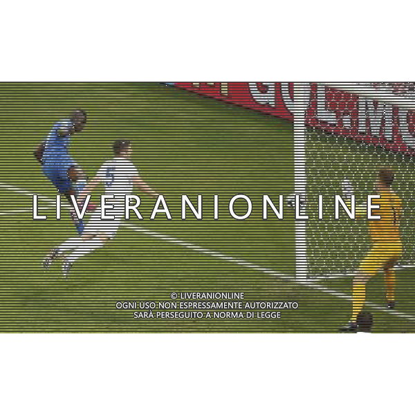 (140614) -- MANAUS, June 14, 2014 () -- Italy\'s Mario Balotelli (1st L) goals a headball during a Group D match between England and Italy of 2014 FIFA World Cup at the Arena Amazonia Stadium in Manaus, Brazil, June 14, 2014. (/Liao Yujie)(pcy) ©PHOTOSHOT/Agenzia Aldo Liverani sas - ITALY ONLY - EDITORIAL USE ONLY - Italia - Inghilterra partita del Gruppo D coppa del mondo 2014 FIFA World Cup Stadio all\'Arena Amazzonia a Manaus, Brasile, 14 giugno 2014