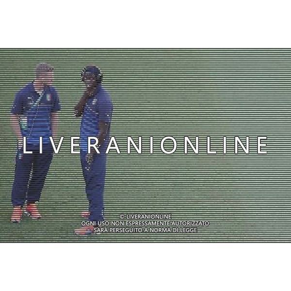 (140614) -- MANAUS, June 14, 2014 () -- Italy\'s Mario Balotelli (R) is seen on the field before a Group D match between England and Italy of 2014 FIFA World Cup at the Arena Amazonia Stadium in Manaus, Brazil, June 14, 2014. (/Liao Yujie)(pcy) ©PHOTOSHOT/Agenzia Aldo Liverani sas - ITALY ONLY - EDITORIAL USE ONLY - Italia - Inghilterra partita del Gruppo D coppa del mondo 2014 FIFA World Cup Stadio all\'Arena Amazzonia a Manaus, Brasile, 14 giugno 2014