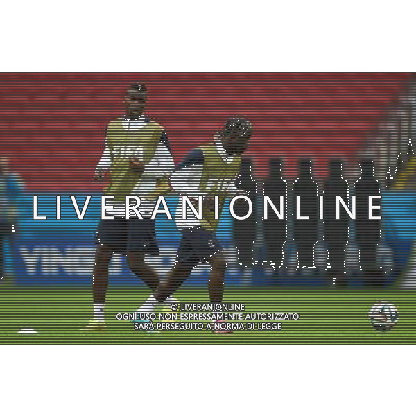 (140614) -- PORTO ALEGRE, June 14, 2014 () -- France\'s Paul Pogba (L) and Bacary Sagna attend a training session in Porto Alegre, Brazil, June 14, 2014. (/Li Ga)(rh) ©PHOTOSHOT/Agenzia Aldo Liverani sas - ITALY ONLY - EDITORIAL USE ONLY - Allenamento dei giocatori della nazionale della francia a Porto Alegre, in Brasile, 14 giugno, 2014