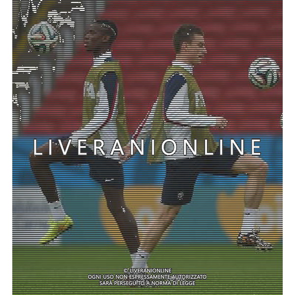 (140614) -- PORTO ALEGRE, June 14, 2014 () -- France\'s Paul Pogba (L) and Laurent Koscielny attend a training session in Porto Alegre, Brazil, June 14, 2014. (/Li Ga)(rh) ©PHOTOSHOT/Agenzia Aldo Liverani sas - ITALY ONLY - EDITORIAL USE ONLY - Allenamento dei giocatori della nazionale della francia a Porto Alegre, in Brasile, 14 giugno, 2014