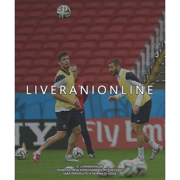 (140614) -- PORTO ALEGRE, June 14, 2014 () -- France\'s Olivier Giroud (L) and Karim Benzema attend a training session in Porto Alegre, Brazil, June 14, 2014. (/Li Ga)(rh) ©PHOTOSHOT/Agenzia Aldo Liverani sas - ITALY ONLY - EDITORIAL USE ONLY - Allenamento dei giocatori della nazionale della francia a Porto Alegre, in Brasile, 14 giugno, 2014