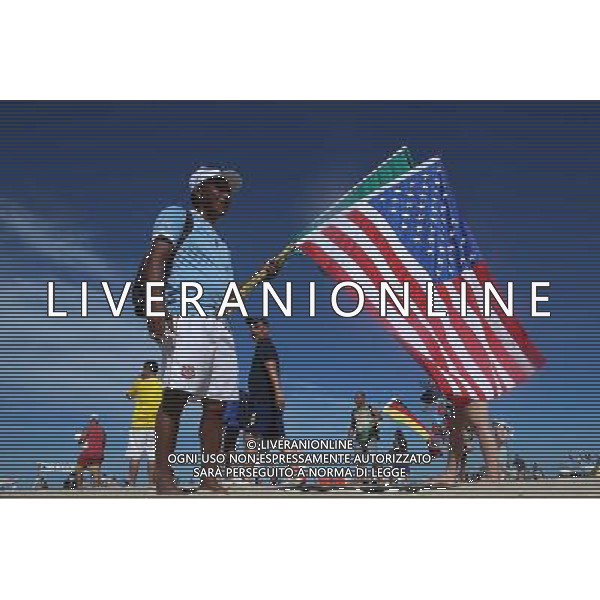 (140614) -- RIO DE JANEIRO, June 14, 2014 () -- A vendor sells flags at the Copacabana Beach in Rio de Janeiro, Brazil, June 14, 2014. (/Rahel Patrasso)(rh) ©PHOTOSHOT/Agenzia Aldo Liverani sas - ITALY ONLY - EDITORIAL USE ONLY - Il Brasile ospita la coppa del mondo FIFA World Cup 2014