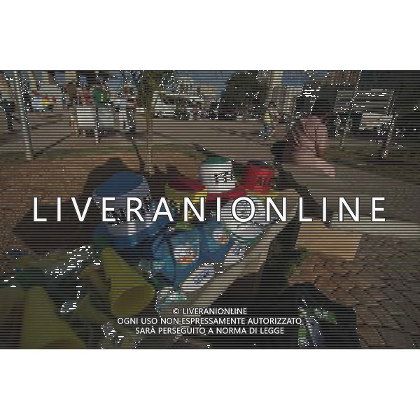 (140614) -- BRASILIA, June 14, 2014 () -- A woman selling objects of World Cup sits near the TV tower in Brasilia, Brazil, on June 14, 2014. (/Jhon Paz) (rh) ©PHOTOSHOT/Agenzia Aldo Liverani sas - ITALY ONLY - EDITORIAL USE ONLY - Il Brasile ospita la coppa del mondo FIFA World Cup 2014