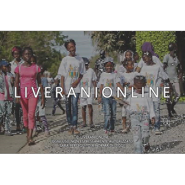 (140615) -- DAKAR, June 15, 2014 () -- Kids attend the Kaya Walk event in Dakar, capital of Senegal, June 15, 2014. Hundreds of parents plan to walk with their children for two hours on the eve of International Day of the African Child, which falls on June 16, to call on more attention and charity towards children suffered from cancer. (/Li Jing)(cy) ©PHOTOSHOT/Agenzia Aldo Liverani sas - ITALY ONLY - EDITORIAL USE ONLY - Centinaia di genitori e Bambini partecipano all\'evento Passeggiata Kaya a Dakar, capitale del Senegal, 15 giugno 2014 alla Giornata Internazionale del Bambino Africano