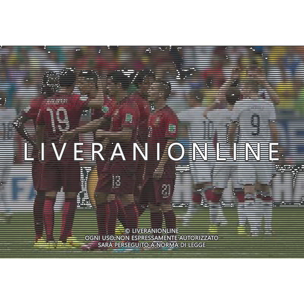 (140616) -- SALVADOR, June 16, 2014 () -- Portugal\'s players are seen as Germany\'s players celebrate their victory at the end of a Group G match between Germany and Portugal of 2014 FIFA World Cup at the Arena Fonte Nova Stadium in Salvador, Brazil, June 16, 2014. Germany won 4-0 over Portugal on Monday.(/Yang Lei)(rh) AG ALDO LIVERANI SAS ONLY ITALY