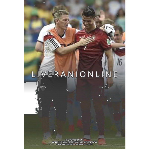 (140616) -- SALVADOR, June 16, 2014 () -- Germany\'s Bastian Schweinsteiger (L) greets Portugal\'s Cristiano Ronaldo at the end of a Group G match between Germany and Portugal of 2014 FIFA World Cup at the Arena Fonte Nova Stadium in Salvador, Brazil, June 16, 2014. Germany won 4-0 over Portugal on Monday. (/Yang Lei)(xzj) AG ALDO LIVERANI SAS ONLY ITALY