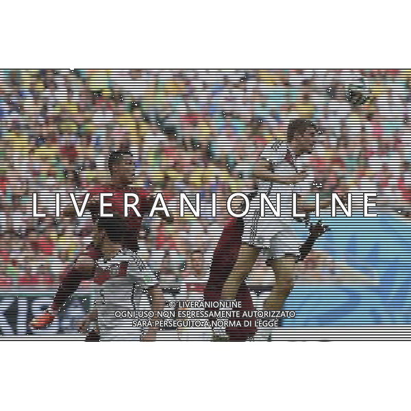 (140616) -- SALVADOR, June 16, 2014 () -- Germany\'s Thomas Muller competes for a header (1st R) during a Group G match between Germany and Portugal of 2014 FIFA World Cup at the Arena Fonte Nova Stadium in Salvador, Brazil, June 16, 2014. (/Qi Heng)(pcy) AG ALDO LIVERANI SAS ONLY ITALY