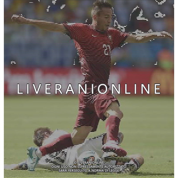 (140616) -- SALVADOR, June 16, 2014 () -- Portugal\'s Joao Pereira (front) runs with the ball during a Group G match between Germany and Portugal of 2014 FIFA World Cup at the Arena Fonte Nova Stadium in Salvador, Brazil, June 16, 2014. (/Yang Lei)(xzj) AG ALDO LIVERANI SAS ONLY ITALY