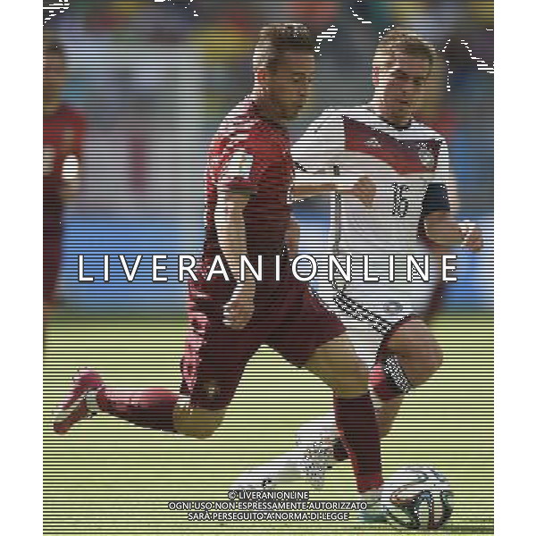 (140616) -- SALVADOR, June 16, 2014 () -- Germany\'s Philipp Lahm (R) competes with Portugal\'s Joao Pereira during a Group G match between Germany and Portugal of 2014 FIFA World Cup at the Arena Fonte Nova Stadium in Salvador, Brazil, June 16, 2014. (/Yang Lei)(xzj) AG ALDO LIVERANI SAS ONLY ITALY