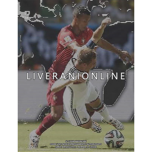 (140616) -- SALVADOR, June 16, 2014 () -- Germany\'s Philipp Lahm (R) competes with Portugal\'s Joao Pereira during a Group G match between Germany and Portugal of 2014 FIFA World Cup at the Arena Fonte Nova Stadium in Salvador, Brazil, June 16, 2014. (/Yang Lei)(xzj) AG ALDO LIVERANI SAS ONLY ITALY