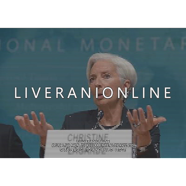 (140616) -- WASHINGTON D.C., June 16, 2014 () -- International Monetary Fund(IMF) Managing Director Christine Lagarde(R) speaks during a press conference at the IMF headquarters in Washington D.C., the United States, on June 16, 2014. The International Monetary Fund on Monday sharply lowered its U.S. economic growth forecasts for this year from the perviously predicted 2.8 percent to 2 percent due to a weak first quarter. (/Yin Bogu) AG ALDO LIVERANI SAS ONLY ITALY