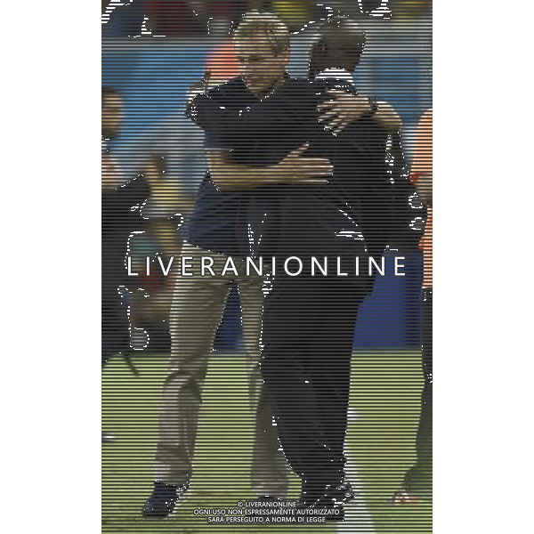 (140616) -- NATAL, June 16, 2014 () -- Ghana\'s coach Kwesi Appiah (R) hugs Jurgen Klinsmann, couch of U.S., during a Group G match between Ghana and U.S. of 2014 FIFA World Cup at the Estadio das Dunas Stadium in Natal, Brazil, June 16, 2014. U.S. won 2-1 over Ghana on Monday. (/Lui Siu Wai)(rh) AG ALDO LIVERANI SAS ONLY ITALY