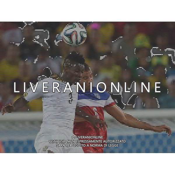 (140616) -- NATAL, June 16, 2014 () -- Ghana\'s Asamoah Gyan competes for a header with John Brooks of U.S. during a Group G match between Ghana and U.S. of 2014 FIFA World Cup at the Estadio das Dunas Stadium in Natal, Brazil, June 16, 2014. (/Guo Yong)(rh) AG ALDO LIVERANI SAS ONLY ITALY
