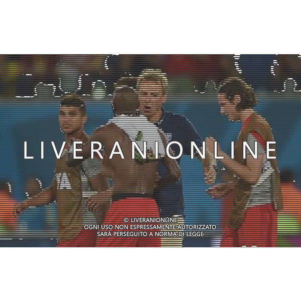 (140616) -- NATAL, June 16, 2014 () -- Jurgen Klinsmann(C), Coach of U.S., hugs Damarcus Beasley celebrating their victory after a Group G match between Ghana and U.S. of 2014 FIFA World Cup at the Estadio das Dunas Stadium in Natal, Brazil, June 16, 2014. U.S. won 2-1 over Ghana on Monday. (/Guo Yong)(rh) AG ALDO LIVERANI SAS ONLY ITALY