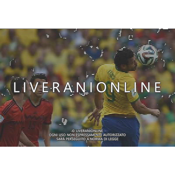 (140617) -- FORTALEZA, June 17, 2014 () -- Brazil\'s Fred competes (R) a header during a Group A match between Brazil and Mexico of 2014 FIFA World Cup at the Estadio Castelao Stadium in Fortaleza, Brazil, June 17, 2014.(/Guo Yong)(rh) AG ALDO LIVERANI SAS ONLY ITALY