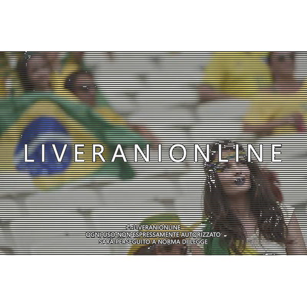 (140617) -- FORTALEZA, June 17, 2014 () -- A fan of team Brazil cheers prior to a Group A match between Brazil and Mexico of 2014 FIFA World Cup at the Estadio Castelao Stadium in Fortaleza, Brazil, June 17, 2014.(/Lui Siu Wai)(xzj) AG ALDO LIVERANI SAS ONLY ITALY