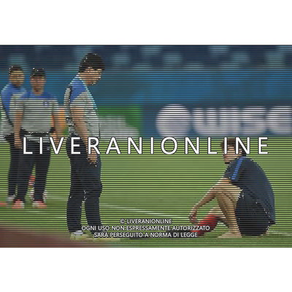 (140616) -- CUIABA, June 16, 2014 () -- Korea Republic\'s Ha Dae-Sung lies down on the field because of the pain on foot during a training session of 2014 FIFA World Cup at the Arena Pantanal Stadium in Cuiaba, Brazil, June 16, 2014. (/Liu Dawei)(rh) AG ALDO LIVERANI SAS ONLY ITALY