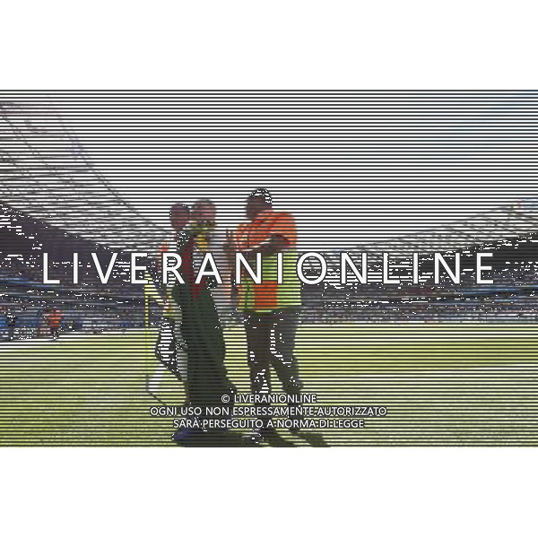 (140617) -- BELO HORIZONTE, June 17, 2014 () -- A fan (C) is escorted by the security guards as he jumped into the pitch prior to a Group H match between Belgium and Algeria of 2014 FIFA World Cup at the Estadio Mineirao Stadium in Belo Horizonte, Brazil, June 17, 2014.(/Liu Bin)(xzj) AG ALDO LIVERANI SAS ONLY ITALY