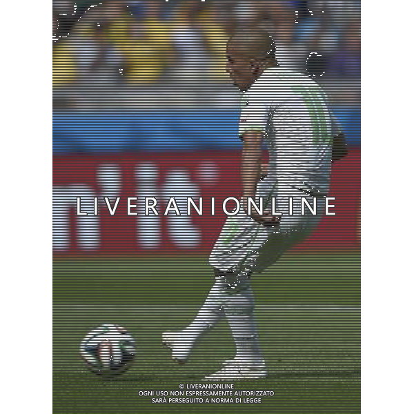 (140617) -- BELO HORIZONTE, June 17, 2014 () -- Algeria\'s Sofiane Feghouli shoots a penalty score during a Group H match between Belgium and Algeria of 2014 FIFA World Cup at the Estadio Mineirao Stadium in Belo Horizonte, Brazil, June 17, 2014.(/Qi Heng)(rh) AG ALDO LIVERANI SAS ONLY ITALY