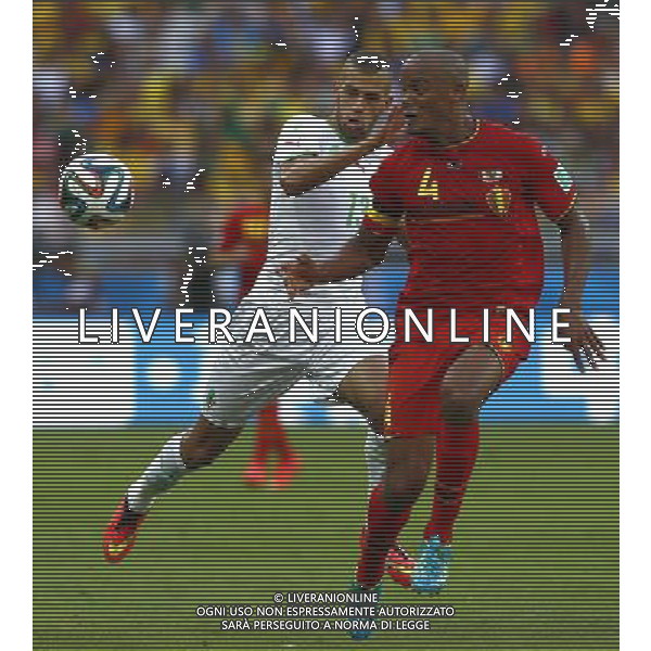(140617) -- BELO HORIZONTE, June 17, 2014 () -- Belgium\'s Vincent Kompany (R) vies with Algeria\'s Islam Slimani during a Group H match between Belgium and Algeria of 2014 FIFA World Cup at the Estadio Mineirao Stadium in Belo Horizonte, Brazil, June 17, 2014.(/Liu Bin)(xzj) AG ALDO LIVERANI SAS ONLY ITALY
