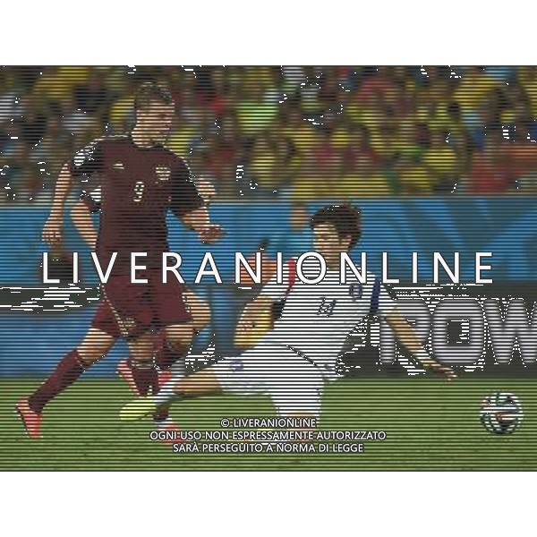 (140617) -- CUIABA, June 17, 2014 () -- Korea Republic\'s Han Kook Young (R) vies with Russia\'s Aleksandr Kokorin during a Group H match between Russia and Korea Republic of 2014 FIFA World Cup at the Arena Pantanal Stadium in Cuiaba, Brazil, June 17, 2014.(/Liu Dawei)(pcy) ©PHOTOSHOT/Agenzia Aldo Liverani sas - ITALY ONLY - EDITORIAL USE ONLY - Russia Vs Corea del Sud partita del Gruppo H Coppa del Mondo FIFA 2014 Pantanal stadio Arena di Cuiaba, Brasile, 17 giugno 2014