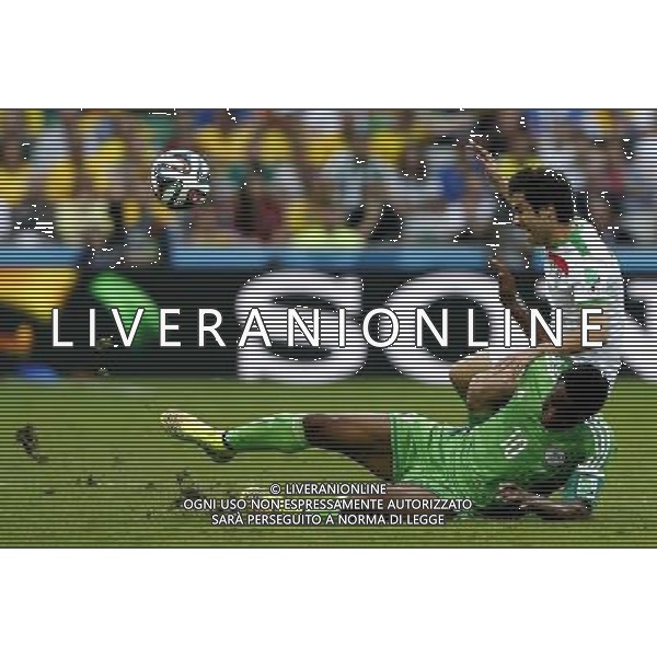 (140616) -- CURITIBA, June 16, 2014 () -- Iran\'s Khosro Heydari (R) vies with Nigeria\'s Mikel Obi during a Group F match between Iran and Nigeria of 2014 FIFA World Cup at the Arena da Baixada Stadium in Curitiba, Brazil, June 16, 2014. (/Zhou Lei)(pcy) ©PHOTOSHOT/Agenzia Aldo Liverani sas - ITALY ONLY - EDITORIAL USE ONLY - IRAN Vs NIGERIA partita del Gruppo F Coppa del mondo FIFA 2014 presso l\'Arena da Baixada Stadium di Curitiba, in Brasile, 16 giugno 2014