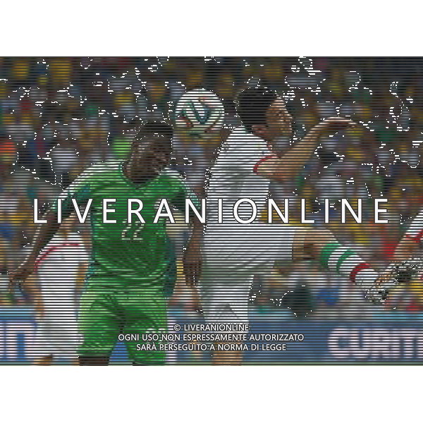 (140616) -- CURITIBA, June 16, 2014 () -- Nigeria\'s Kenneth Omeruo competes to gain control of the ball with Iran\'s Javad Nekounam during a Group F match between Iran and Nigeria of 2014 FIFA World Cup at the Arena da Baixada Stadium in Curitiba, Brazil, June 16, 2014. (/Liao Yujie)(xzj) ©PHOTOSHOT/Agenzia Aldo Liverani sas - ITALY ONLY - EDITORIAL USE ONLY - IRAN Vs NIGERIA partita del Gruppo F Coppa del mondo FIFA 2014 presso l\'Arena da Baixada Stadium di Curitiba, in Brasile, 16 giugno 2014