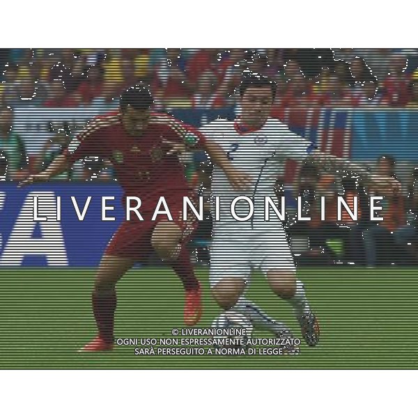 (140618) -- RIO DE JANEIRO, June 18, 2014 () -- Spain\'s Pedro Rodriguez vies with Chile\'s Eugenio Mena during a Group B match between Spain and Chile of 2014 FIFA World Cup at the Estadio do Maracana Stadium in Rio de Janeiro, Brazil, June 18, 2014.(/Wang Yuguo)(rh) ©PHOTOSHOT/Agenzia Aldo Liverani sas - ITALY ONLY - EDITORIAL USE ONLY - Spagna Vs Cile partita del Gruppo B Coppa del Mondo 2014 FIFA a Estadio do Stadio Maracana\' di Rio de Janeiro, in Brasile, 18 Giugno 2014 il Cile ha vinto per 2-0 contro la Spagna