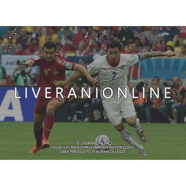 (140618) -- RIO DE JANEIRO, June 18, 2014 () -- Spain\'s Pedro Rodriguez vies with Chile\'s Eugenio Mena during a Group B match between Spain and Chile of 2014 FIFA World Cup at the Estadio do Maracana Stadium in Rio de Janeiro, Brazil, June 18, 2014.(/Wang Yuguo)(rh) ©PHOTOSHOT/Agenzia Aldo Liverani sas - ITALY ONLY - EDITORIAL USE ONLY - Spagna Vs Cile partita del Gruppo B Coppa del Mondo 2014 FIFA a Estadio do Stadio Maracana\' di Rio de Janeiro, in Brasile, 18 Giugno 2014 il Cile ha vinto per 2-0 contro la Spagna