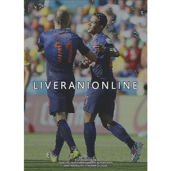 (140618) -- PORTO ALEGRE, June 18, 2014 () -- Netherlands\'s Memphis Depay (R) celebrates a goal during a Group B match between Australia and Netherlands of 2014 FIFA World Cup at the Estadio Beira-Rio Stadium in Porto Alegre, Brazil, June 18, 2014.(/Chen Jianli)(rh) ©PHOTOSHOT/Agenzia Aldo Liverani sas - ITALY ONLY - EDITORIAL USE ONLY - Australia v Olanda partita del Gruppo B Coppa del Mondo FIFA 2014 Estadio Beira -Rio Stadium di Porto Alegre, in Brasile, 18 Giugno 2014. Olanda ha vinto per 3-2 contro l\'Australia