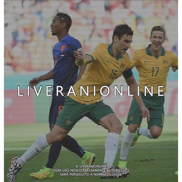 (140618) -- PORTO ALEGRE, June 18, 2014 () -- Australia\'s Mile Jedinak (front) celebrates for his penalty goal during a Group B match between Australia and Netherlands of 2014 FIFA World Cup at the Estadio Beira-Rio Stadium in Porto Alegre, Brazil, June 18, 2014.(/Li Ga)(pcy) ©PHOTOSHOT/Agenzia Aldo Liverani sas - ITALY ONLY - EDITORIAL USE ONLY - Australia v Olanda partita del Gruppo B Coppa del Mondo FIFA 2014 Estadio Beira -Rio Stadium di Porto Alegre, in Brasile, 18 Giugno 2014. Olanda ha vinto per 3-2 contro l\'Australia