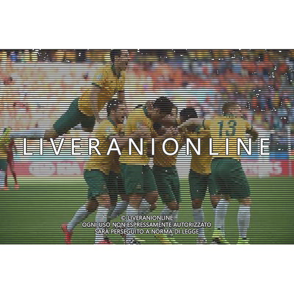 (140618) -- PORTO ALEGRE, June 18, 2014 () -- Australia\'s players celebrate for Mile Jedinak\'s penalty goal during a Group B match between Australia and Netherlands of 2014 FIFA World Cup at the Estadio Beira-Rio Stadium in Porto Alegre, Brazil, June 18, 2014.(/Li Ga)(pcy) ©PHOTOSHOT/Agenzia Aldo Liverani sas - ITALY ONLY - EDITORIAL USE ONLY - Australia v Olanda partita del Gruppo B Coppa del Mondo FIFA 2014 Estadio Beira -Rio Stadium di Porto Alegre, in Brasile, 18 Giugno 2014. Olanda ha vinto per 3-2 contro l\'Australia