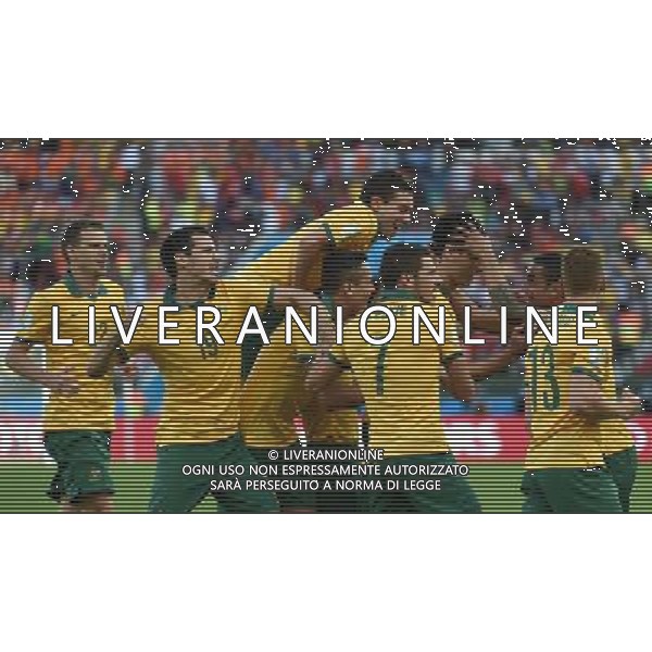 (140618) -- PORTO ALEGRE, June 18, 2014 () -- Australia\'s players celebrate for Mile Jedinak\'s penalty goal during a Group B match between Australia and Netherlands of 2014 FIFA World Cup at the Estadio Beira-Rio Stadium in Porto Alegre, Brazil, June 18, 2014.(/Li Ga)(pcy) ©PHOTOSHOT/Agenzia Aldo Liverani sas - ITALY ONLY - EDITORIAL USE ONLY - Australia v Olanda partita del Gruppo B Coppa del Mondo FIFA 2014 Estadio Beira -Rio Stadium di Porto Alegre, in Brasile, 18 Giugno 2014. Olanda ha vinto per 3-2 contro l\'Australia