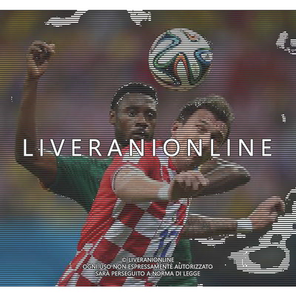 (140618) -- MANAUS, June 18, 2014 () -- Croatia\'s Mario Mandzukic vies for the ball with Cameroon\'s Nicolas Nkoulou during a Group A match between Cameroon and Croatia of 2014 FIFA World Cup at the Arena Amazonia Stadium in Manaus, Brazil, June 18, 2014. Croatia won 4-0 over Cameroon on Wednesday.(/Liu Dawei)(rh) AG ALDO LIVERANI SAS ONLY ITALY