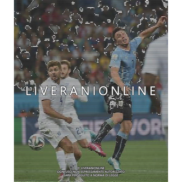 (140619) -- SAO PAULO, June 19, 2014 () -- Uruguay\'s Cristian Rodriguez (R) competes for a header during a Group D match between Uruguay and England of 2014 FIFA World Cup at the Arena de Sao Paulo Stadium in Sao Paulo, Brazil, June 19, 2014.Uruguay won 2-1 over England on Thursday.(/Li Ga)(pcy) 2014 FIFA World Cup Brazil Group D match between Uruguay and England at Arena de Sao Paulo on June 19, 2014 in Sao Paulo, Brazil. ©photoshot/Agenzia Aldo Liverani sas - ITALY ONLY - EDITORIAL USE ONLY