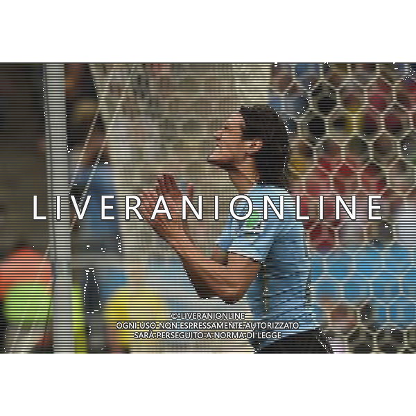 (140619) -- SAO PAULO, June 19, 2014 () -- Uruguay\'s Edinson Cavani reacts after he missed a chance during a Group D match between Uruguay and England of 2014 FIFA World Cup at the Arena de Sao Paulo Stadium in Sao Paulo, Brazil, June 19, 2014.Uruguay won 2-1 over England on Thursday.(/Li Ga)(pcy) 2014 FIFA World Cup Brazil Group D match between Uruguay and England at Arena de Sao Paulo on June 19, 2014 in Sao Paulo, Brazil. ©photoshot/Agenzia Aldo Liverani sas - ITALY ONLY - EDITORIAL USE ONLY