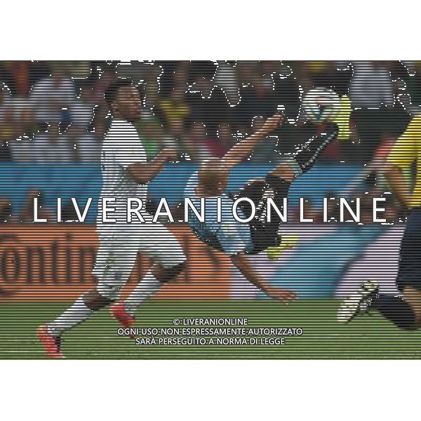 (140619) -- SAO PAULO, June 19, 2014 () -- Uruguay\'s Egidio Arevalo Rios (R) makes an overhead kick during a Group D match between Uruguay and England of 2014 FIFA World Cup at the Arena de Sao Paulo Stadium in Sao Paulo, Brazil, June 19, 2014.Uruguay won 2-1 over England on Thursday.(/Li Ga)(pcy) 2014 FIFA World Cup Brazil Group D match between Uruguay and England at Arena de Sao Paulo on June 19, 2014 in Sao Paulo, Brazil. ©photoshot/Agenzia Aldo Liverani sas - ITALY ONLY - EDITORIAL USE ONLY