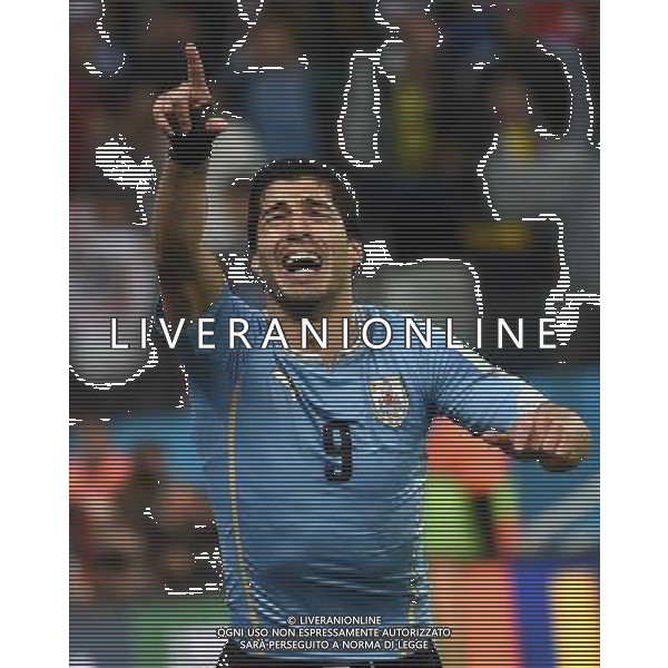 (140619) -- SAO PAULO, June 19, 2014 () -- Uruguay\'s Luis Suarez celebrates for his second goal during a Group D match between Uruguay and England of 2014 FIFA World Cup at the Arena de Sao Paulo Stadium in Sao Paulo, Brazil, June 19, 2014.Uruguay won 2-1 over England on Thursday.(/Li Ga)(pcy) 2014 FIFA World Cup Brazil Group D match between Uruguay and England at Arena de Sao Paulo on June 19, 2014 in Sao Paulo, Brazil. ©photoshot/Agenzia Aldo Liverani sas - ITALY ONLY - EDITORIAL USE ONLY