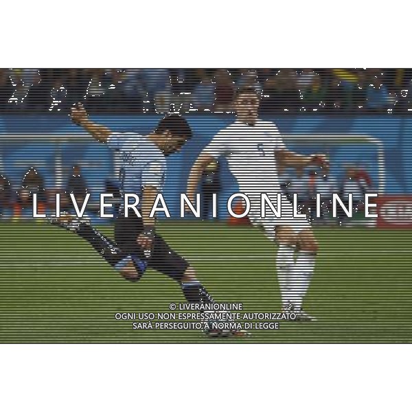 (140619) -- SAO PAULO, June 19, 2014 () -- Uruguay\'s Luis Suarez shoots a ball during a Group D match between Uruguay and England of 2014 FIFA World Cup at the Arena de Sao Paulo Stadium in Sao Paulo, Brazil, June 19, 2014. Uruguay won 2-1 over England on Thursday.(/Chen Jianli)(rh) 2014 FIFA World Cup Brazil Group D match between Uruguay and England at Arena de Sao Paulo on June 19, 2014 in Sao Paulo, Brazil. ©photoshot/Agenzia Aldo Liverani sas - ITALY ONLY - EDITORIAL USE ONLY