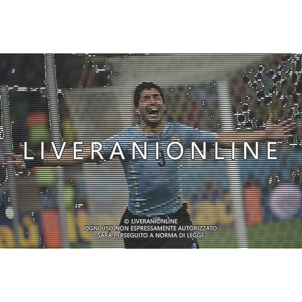 (140619) -- SAO PAULO, June 19, 2014 () -- Uruguay\'s Luis Suarez celebrates for his second goal during a Group D match between Uruguay and England of 2014 FIFA World Cup at the Arena de Sao Paulo Stadium in Sao Paulo, Brazil, June 19, 2014.Uruguay won 2-1 over England on Thursday.(/Li Ga)(pcy) 2014 FIFA World Cup Brazil Group D match between Uruguay and England at Arena de Sao Paulo on June 19, 2014 in Sao Paulo, Brazil. ©photoshot/Agenzia Aldo Liverani sas - ITALY ONLY - EDITORIAL USE ONLY