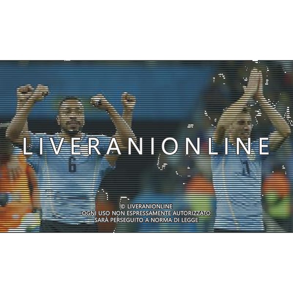 (140619) -- SAO PAULO, June 19, 2014 () -- Uruguay\'s Alvaro Pereira (L) celebrates the victory after a Group D match between Uruguay and England of 2014 FIFA World Cup at the Arena de Sao Paulo Stadium in Sao Paulo, Brazil, June 19, 2014. Uruguay won 2-1 over England on Thursday.(/Chen Jianli)(rh) 2014 FIFA World Cup Brazil Group D match between Uruguay and England at Arena de Sao Paulo on June 19, 2014 in Sao Paulo, Brazil. ©photoshot/Agenzia Aldo Liverani sas - ITALY ONLY - EDITORIAL USE ONLY