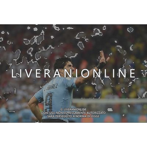 (140619) -- SAO PAULO, June 19, 2014 () -- Uruguay\'s Luis Suarez celebrates for his goal during a Group D match between Uruguay and England of 2014 FIFA World Cup at the Arena de Sao Paulo Stadium in Sao Paulo, Brazil, June 19, 2014.Uruguay won 2-1 over England on Thursday.(/Li Ga)(pcy) 2014 FIFA World Cup Brazil Group D match between Uruguay and England at Arena de Sao Paulo on June 19, 2014 in Sao Paulo, Brazil. ©photoshot/Agenzia Aldo Liverani sas - ITALY ONLY - EDITORIAL USE ONLY